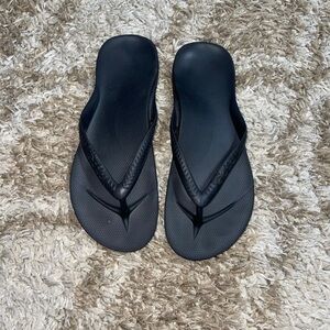 Archie’s flip flops